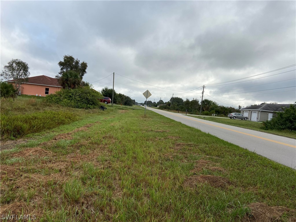 2205 Park Road Lehigh Acres, FL 33971 - Photo 5 of 7 a view of a green field with clear sky