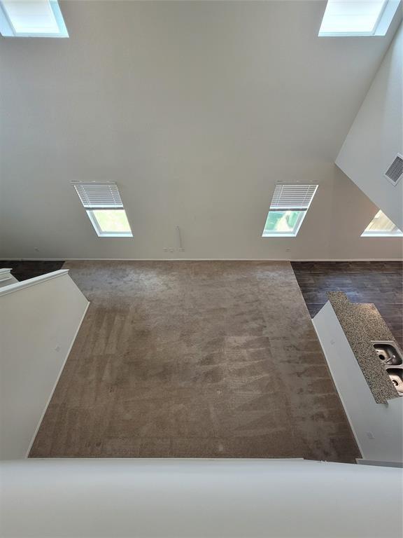 14917 Gypsum Mill Road Manor, TX 78653 - Photo 5 of 28 Natural light floods this room through multiple skylights and angled window placements.
