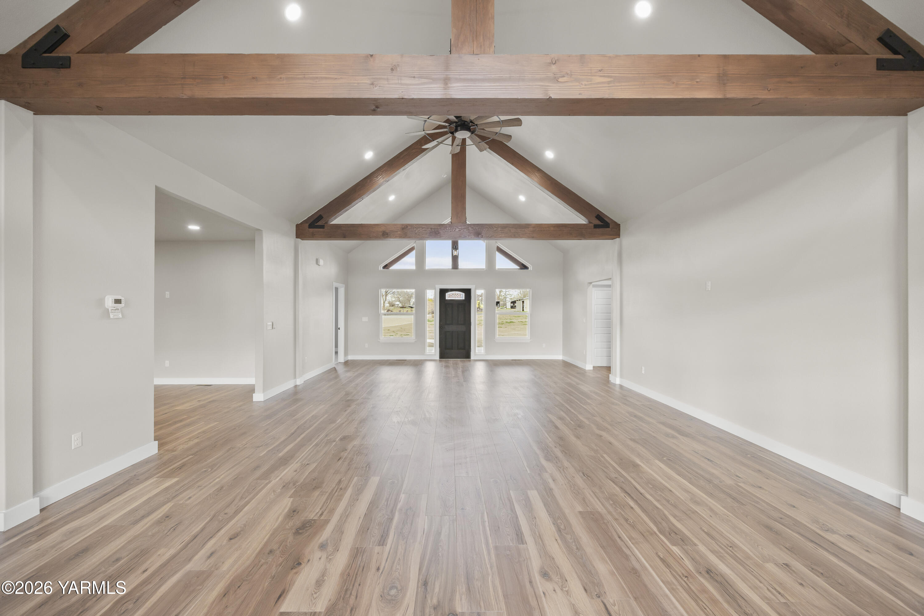 6133 South Moore Road Prosser, WA 99350 - Photo 23 of 54 a view of an empty room with wooden floor and a window