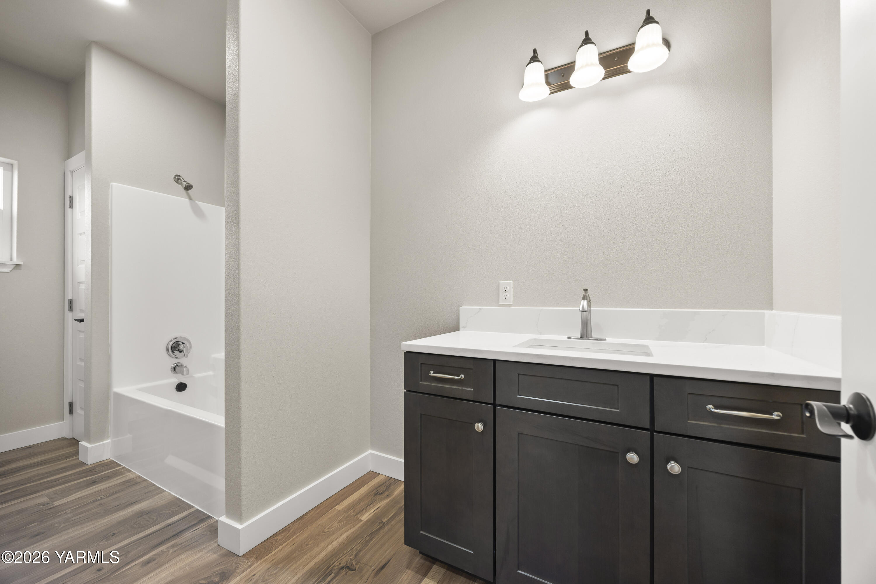 6133 South Moore Road Prosser, WA 99350 - Photo 29 of 54 a bathroom with a sink and mirror