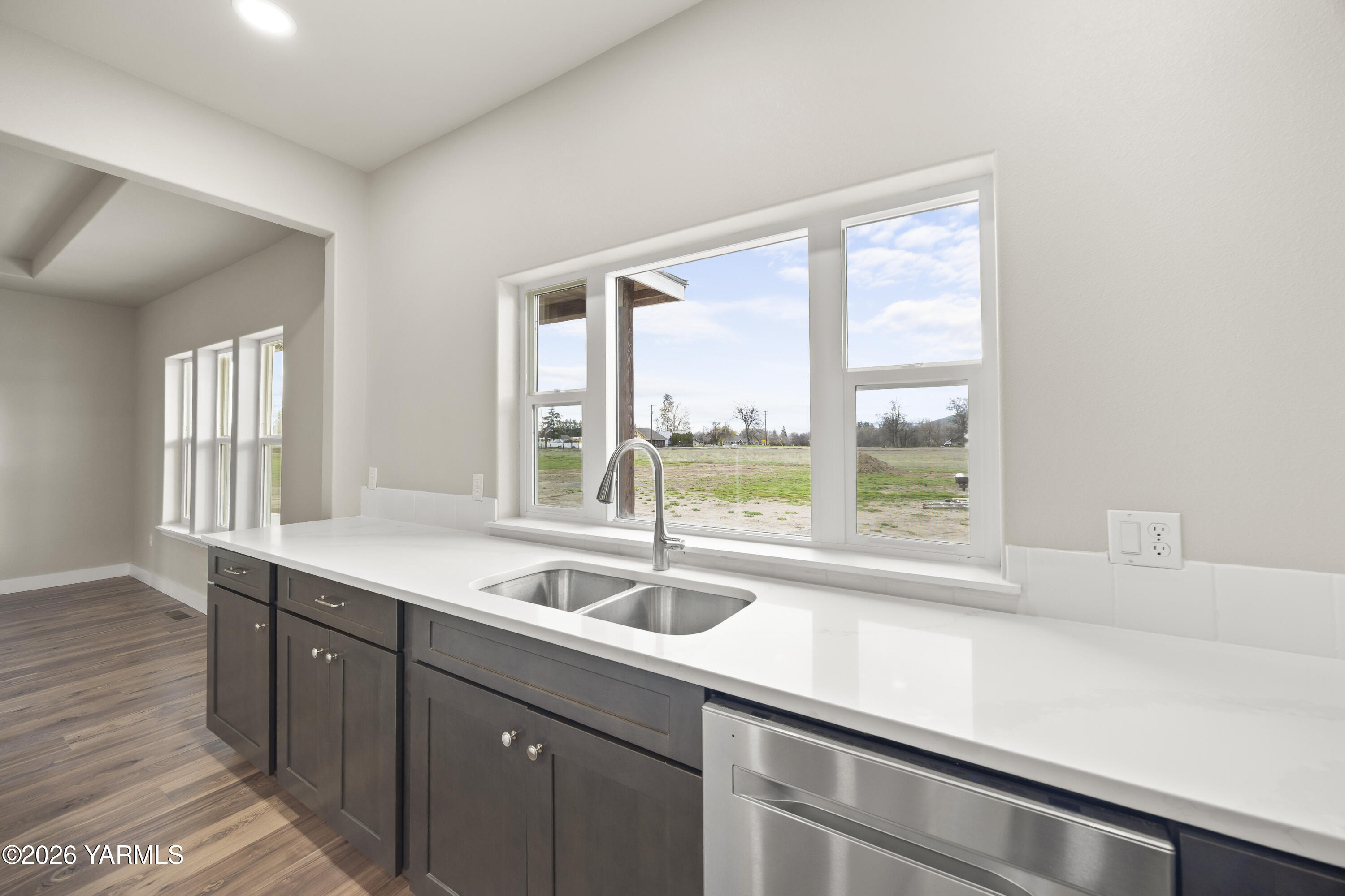 6133 South Moore Road Prosser, WA 99350 - Photo 36 of 54 a kitchen with a sink and large window