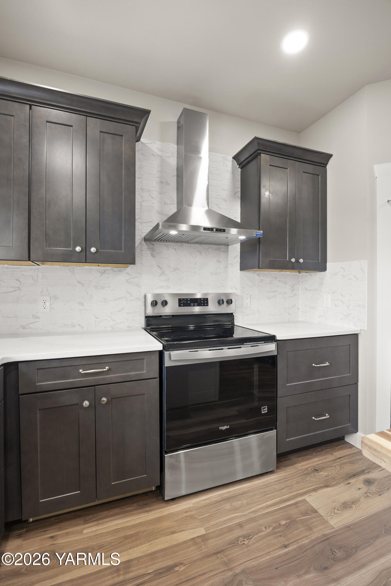 6133 South Moore Road Prosser, WA 99350 - Photo 37 of 54 a kitchen with stainless steel appliances granite countertop a stove and a sink