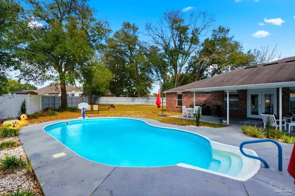 a view of a swimming pool with a patio