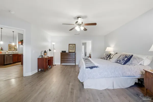 a bed room with bed and a chandelier