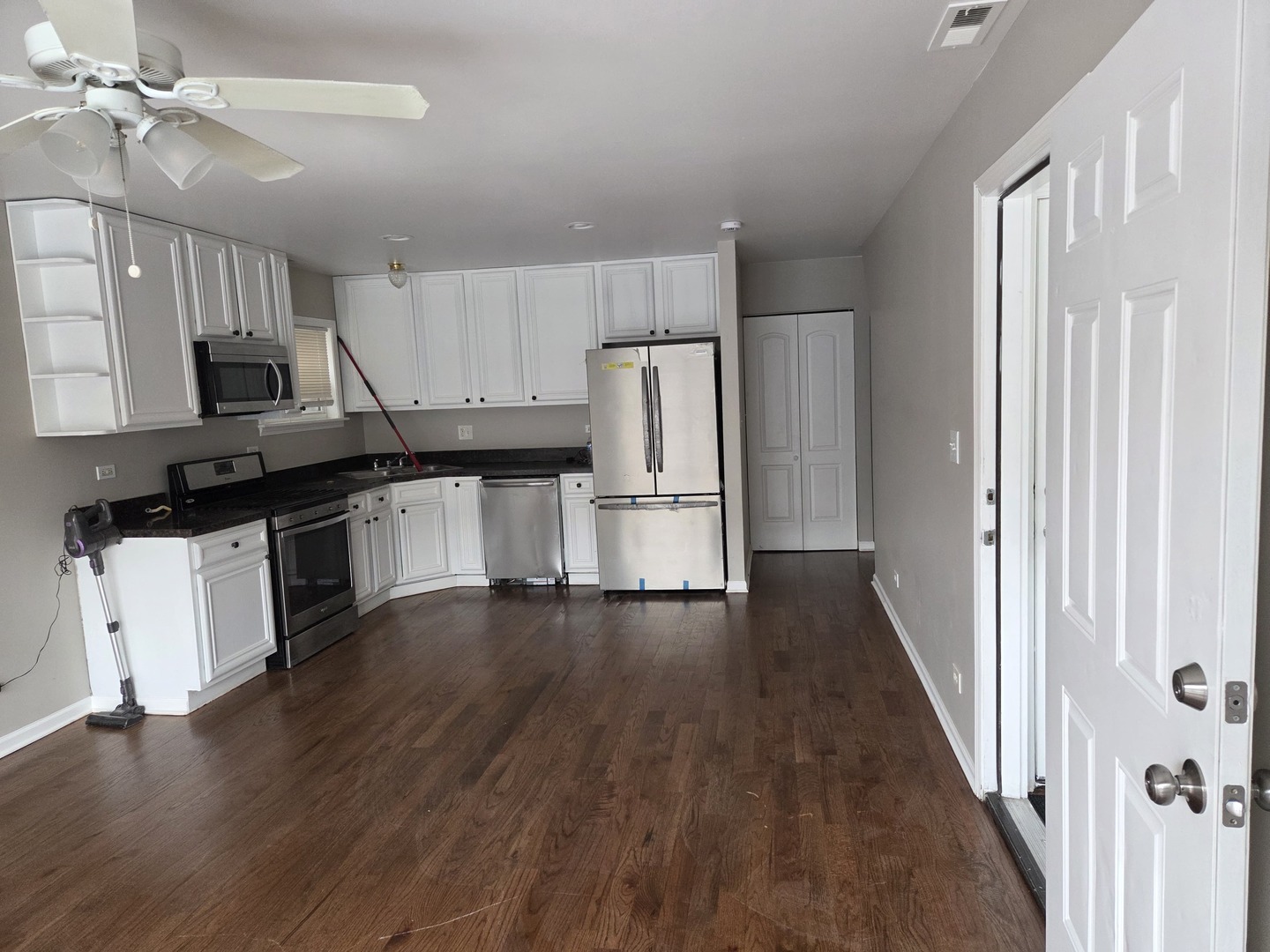 5905 South Indiana Avenue, Unit 1 Chicago, IL 60637 - Photo 3 of 13 a kitchen with stainless steel appliances a refrigerator sink and cabinets