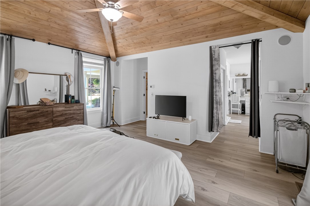 1504 Double Springs Road Townville, SC 29689 - Photo 12 of 41 This airy bedroom features a vaulted wood ceiling, creating a bright and inviting personal retreat.