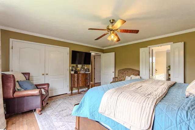 a spacious bathroom with a tub sink and mirror