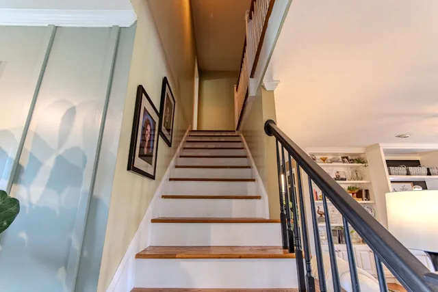 a living room with furniture and a ceiling fan