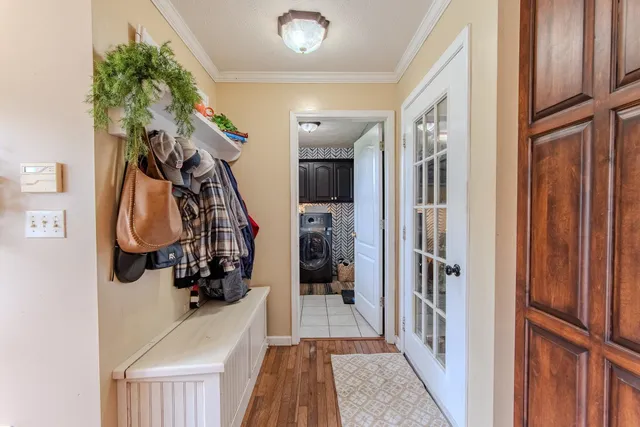 a utility room with sink dryer and washer