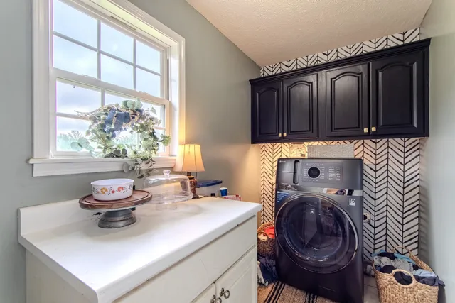 an aerial view of residential houses with outdoor space and swimming pool
