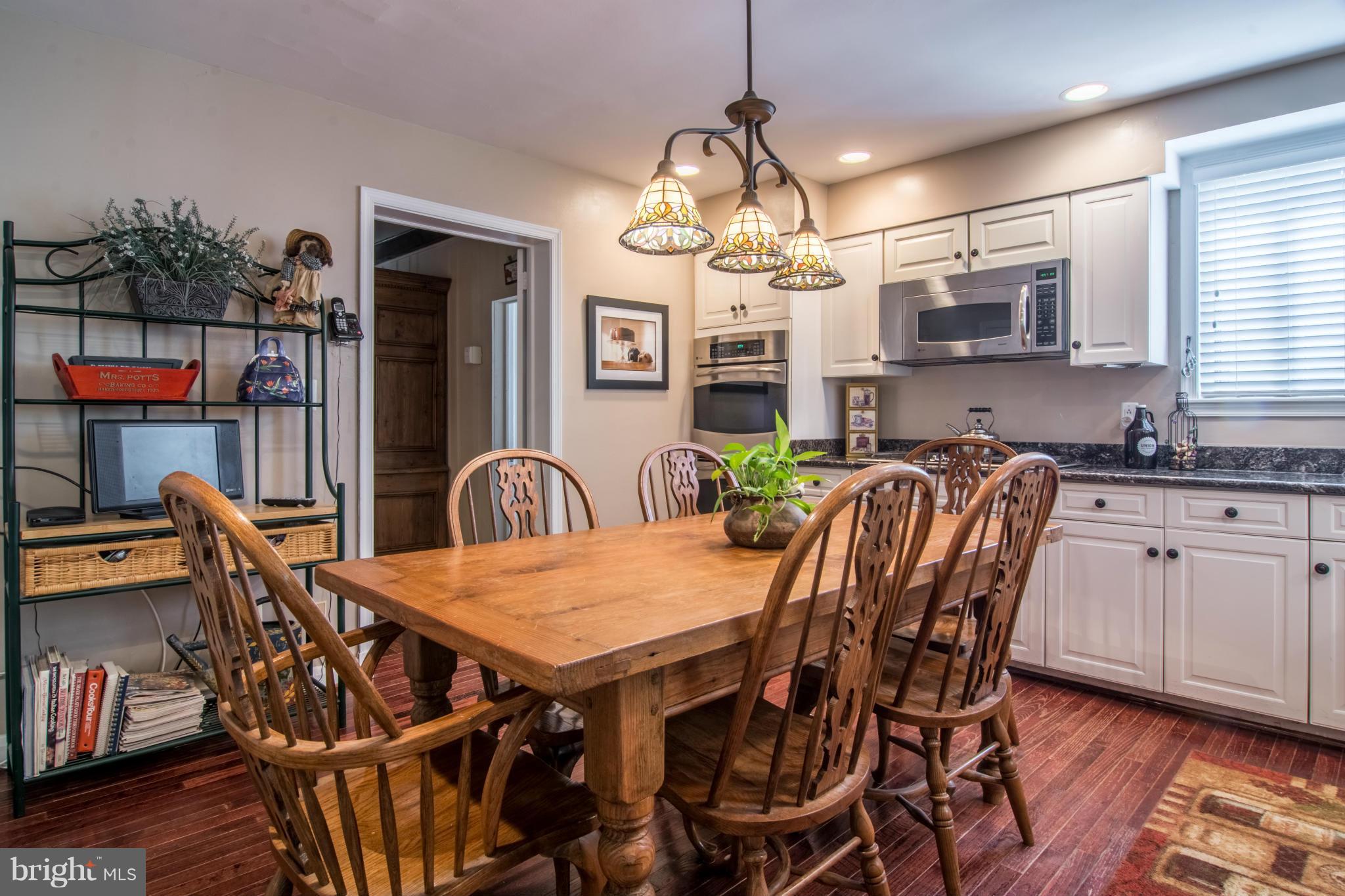 56 Old Hanover Road Reisterstown, MD 21136 - Photo 7 of 30 EAT-IN KITCHEN W/ WOOD FLOORS