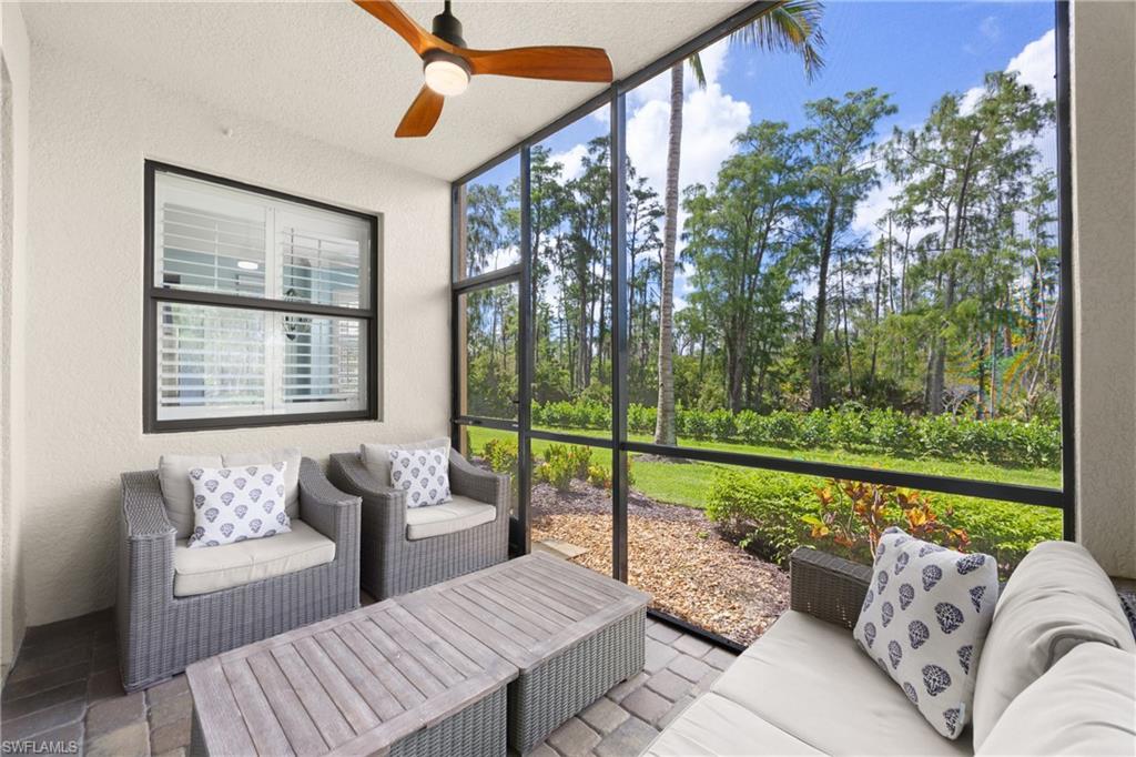 9715 Acqua Court, Unit 116 Naples, FL 34113 - Photo 18 of 43 a outdoor living space with furniture and garden view