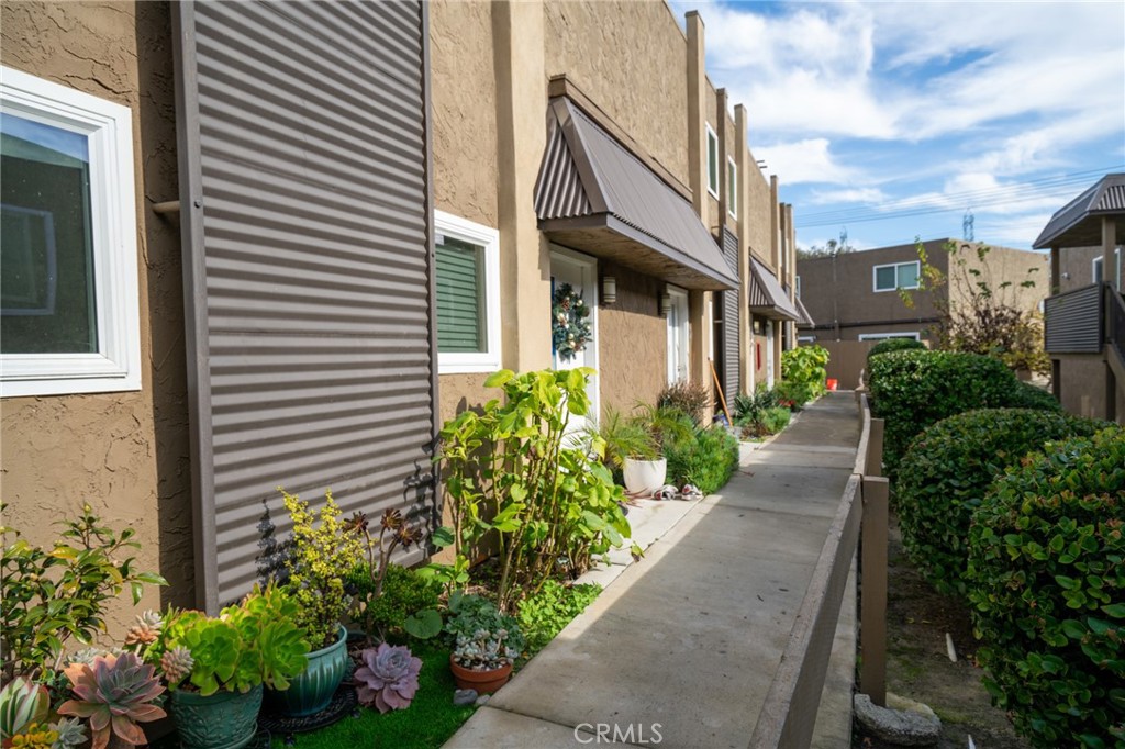 445 Garrison Street Oceanside, CA 92054 - Photo 3 of 12 a view of a pathway along a building