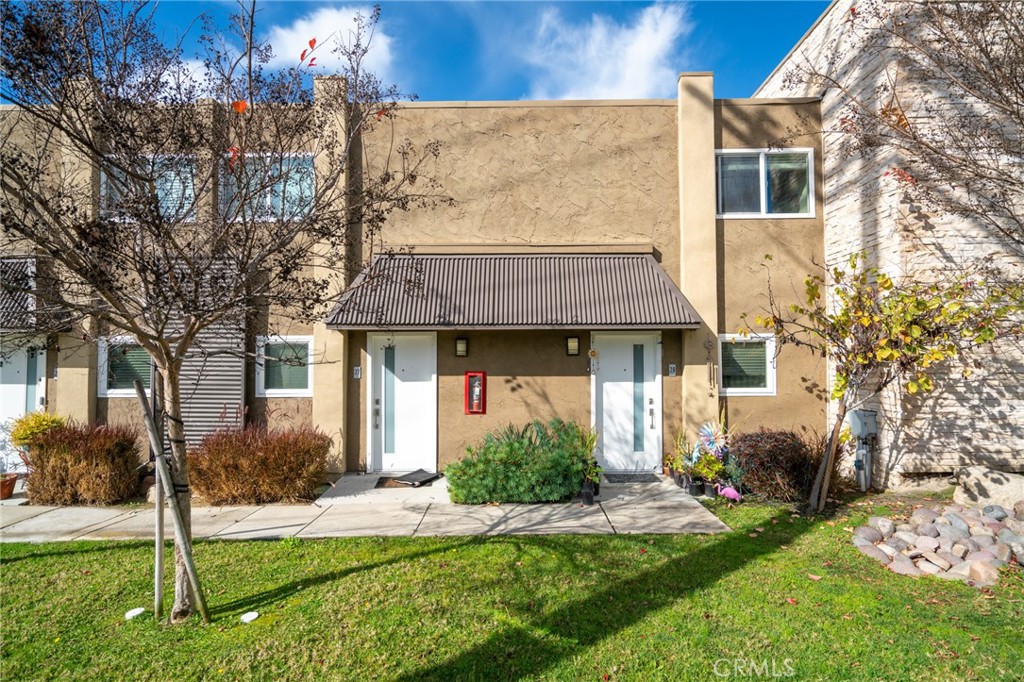445 Garrison Street Oceanside, CA 92054 - Photo 6 of 12 a front view of a house with garden