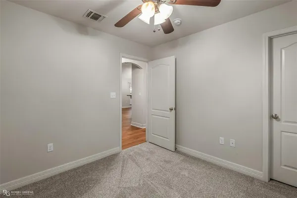 a bathroom with a sink toilet a mirror and shower