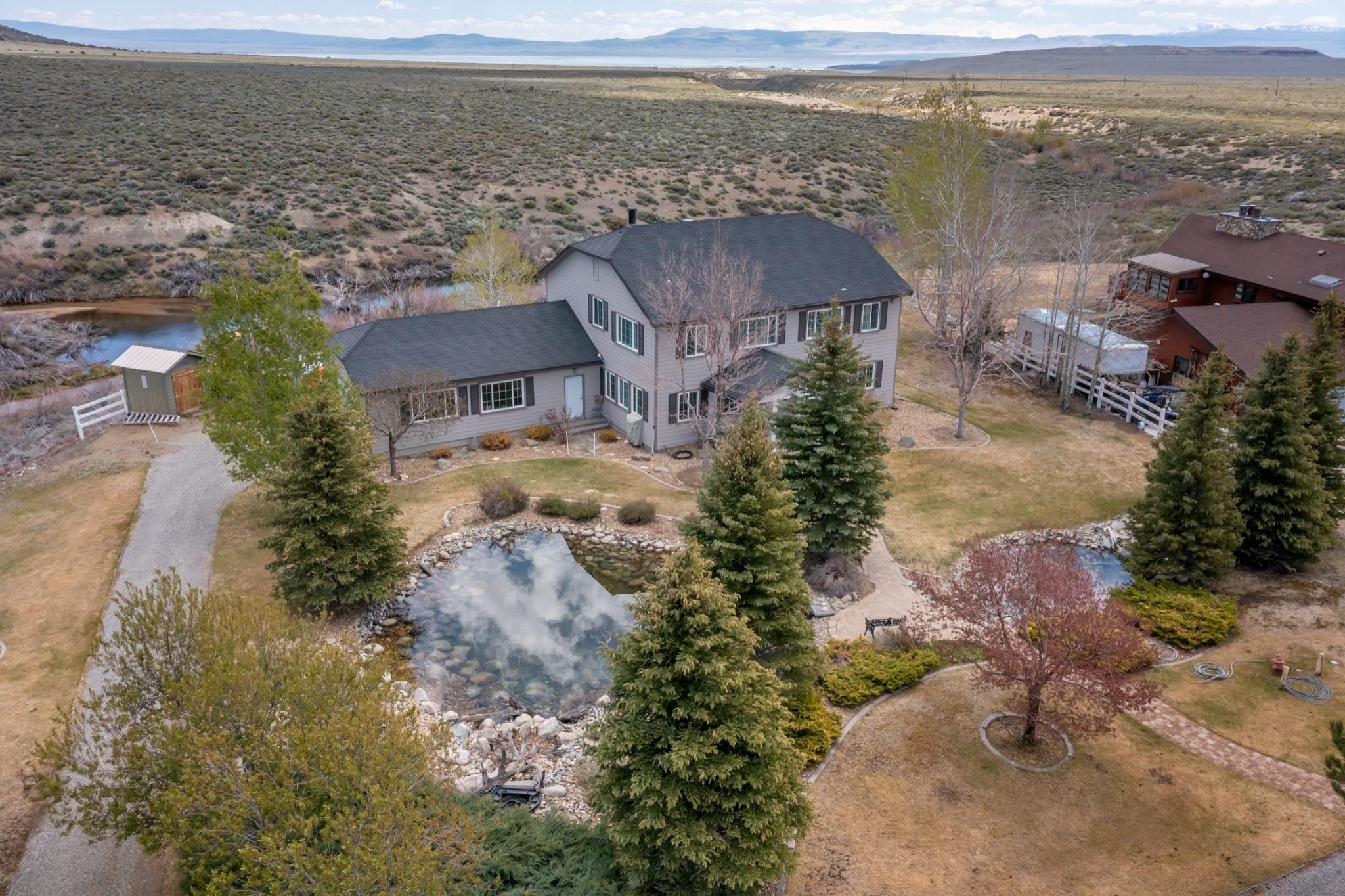 416 Wilson Creek Road Lee Vining, CA 93541 - Photo 4 of 64 an aerial view of a house with a lake view