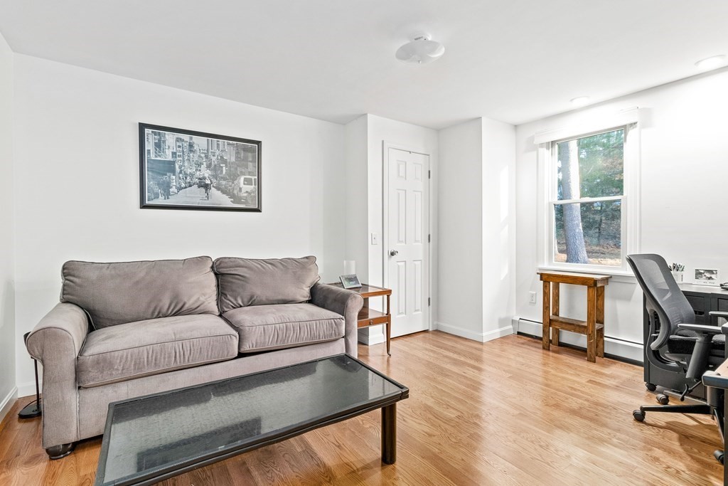 21 Bypass Road Lincoln, MA 01773 - Photo 13 of 21 a living room with furniture a dining table and a window