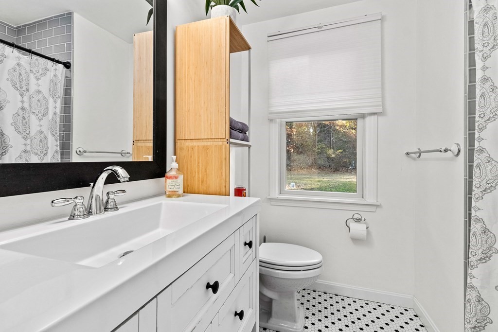 21 Bypass Road Lincoln, MA 01773 - Photo 14 of 21 a bathroom with a sink a toilet and a window