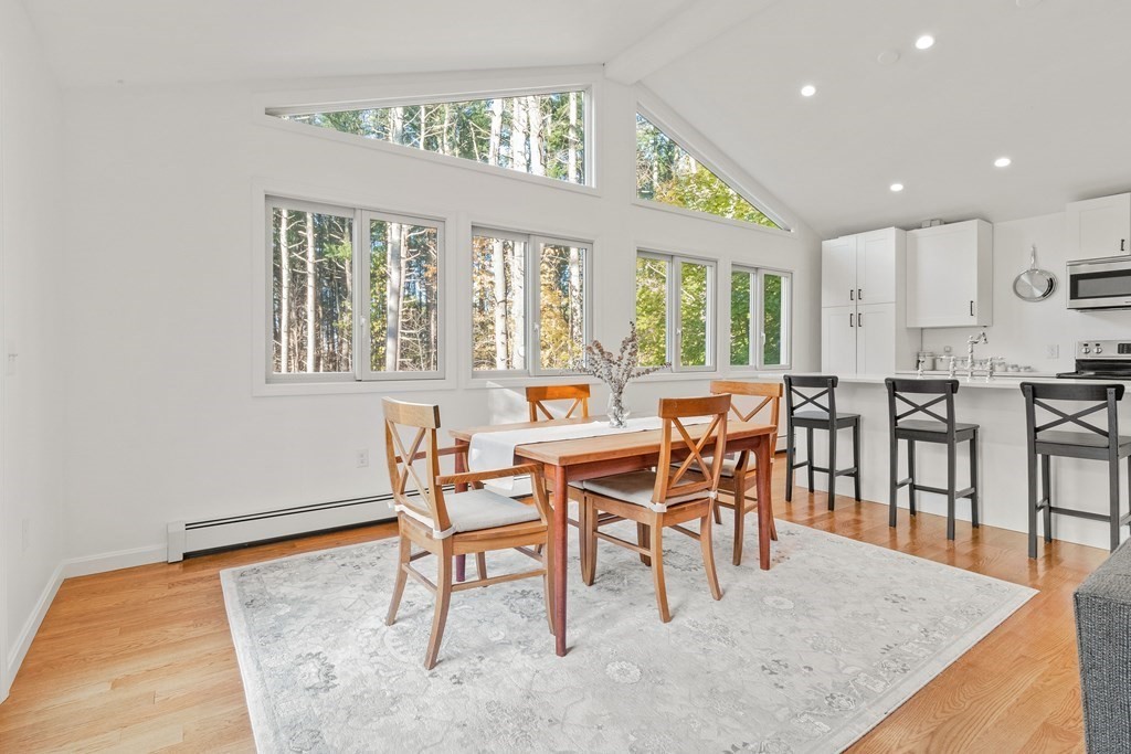 21 Bypass Road Lincoln, MA 01773 - Photo 5 of 21 a dining room with furniture a rug and a large window