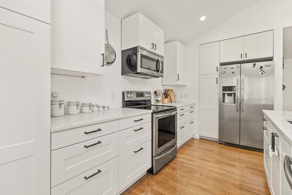 21 Bypass Road Lincoln, MA 01773 - Photo 8 of 21 a kitchen with stainless steel appliances white cabinets and a refrigerator
