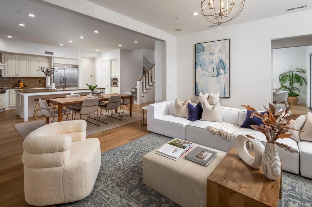 667 Lynwood Drive Encinitas, CA 92024 - Photo 13 of 36 a living room with furniture and a view of kitchen