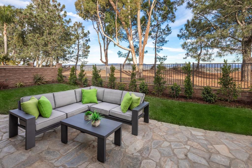 667 Lynwood Drive Encinitas, CA 92024 - Photo 33 of 36 a view of a yard with furniture and a fire pit