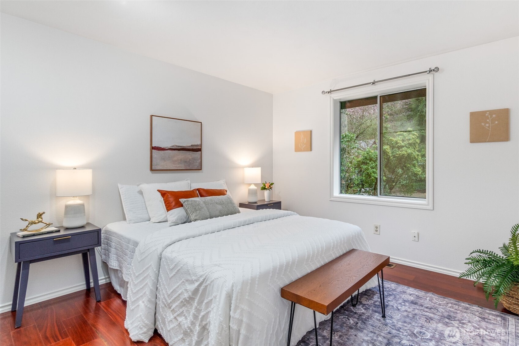 21007 Pioneer Way Edmonds, WA 98026 - Photo 16 of 27 a bedroom with a bed a lamp and a window