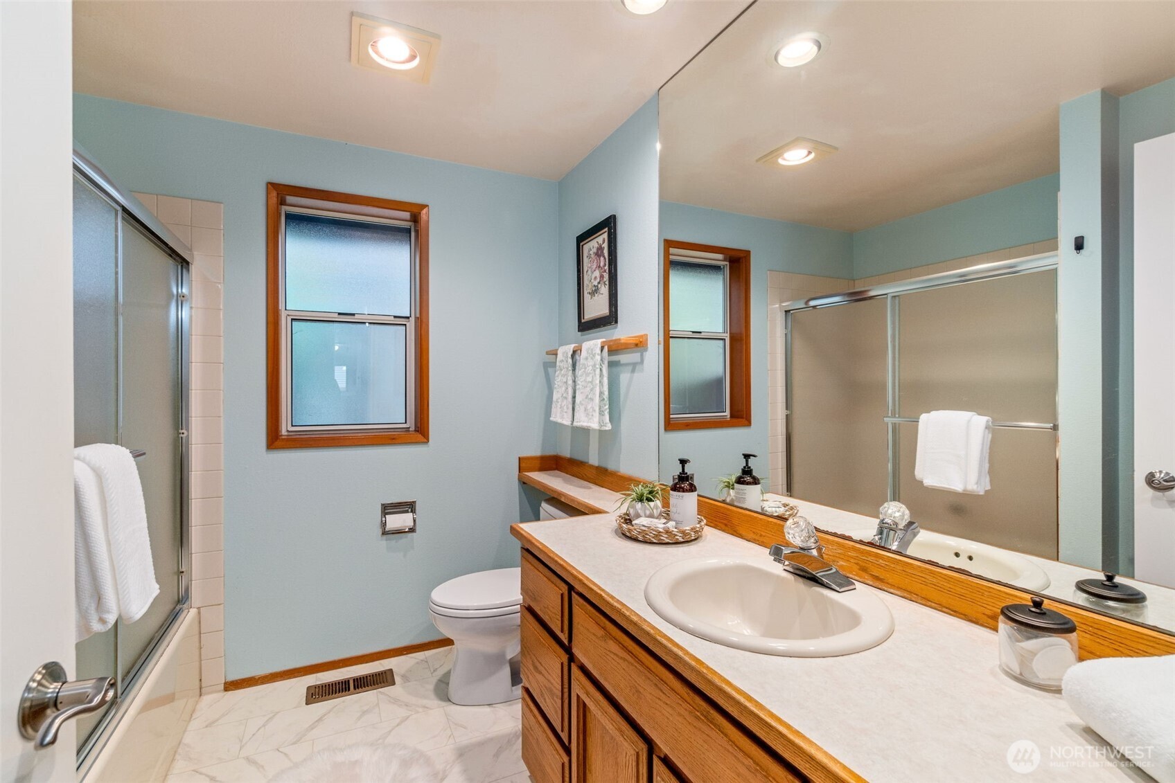 21007 Pioneer Way Edmonds, WA 98026 - Photo 17 of 27 a bathroom with a granite countertop sink toilet and shower