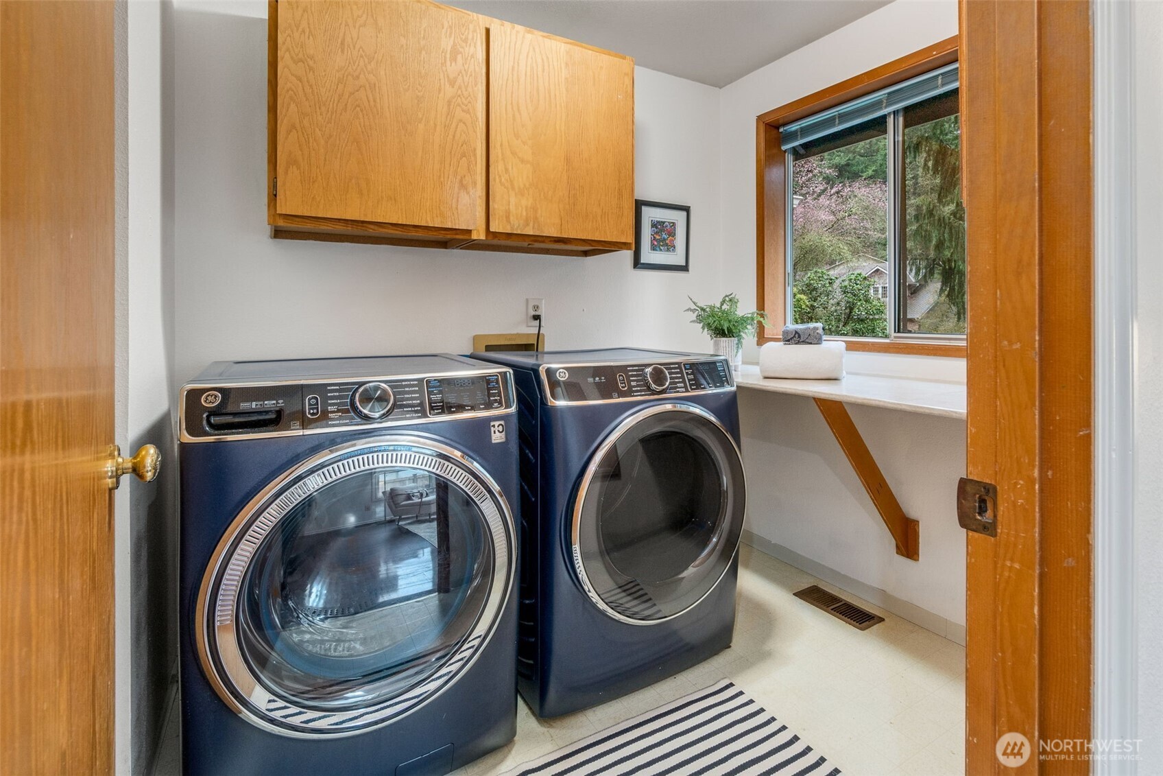 21007 Pioneer Way Edmonds, WA 98026 - Photo 18 of 27 a utility room with sink dryer and washer