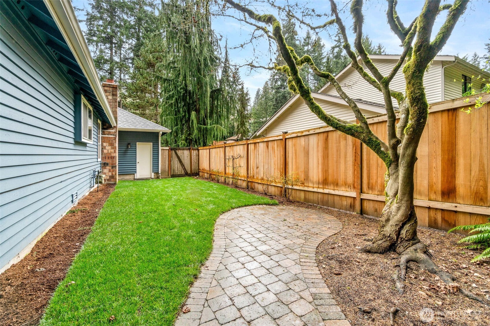 21007 Pioneer Way Edmonds, WA 98026 - Photo 23 of 27 a backyard of a house with wooden floor and fence
