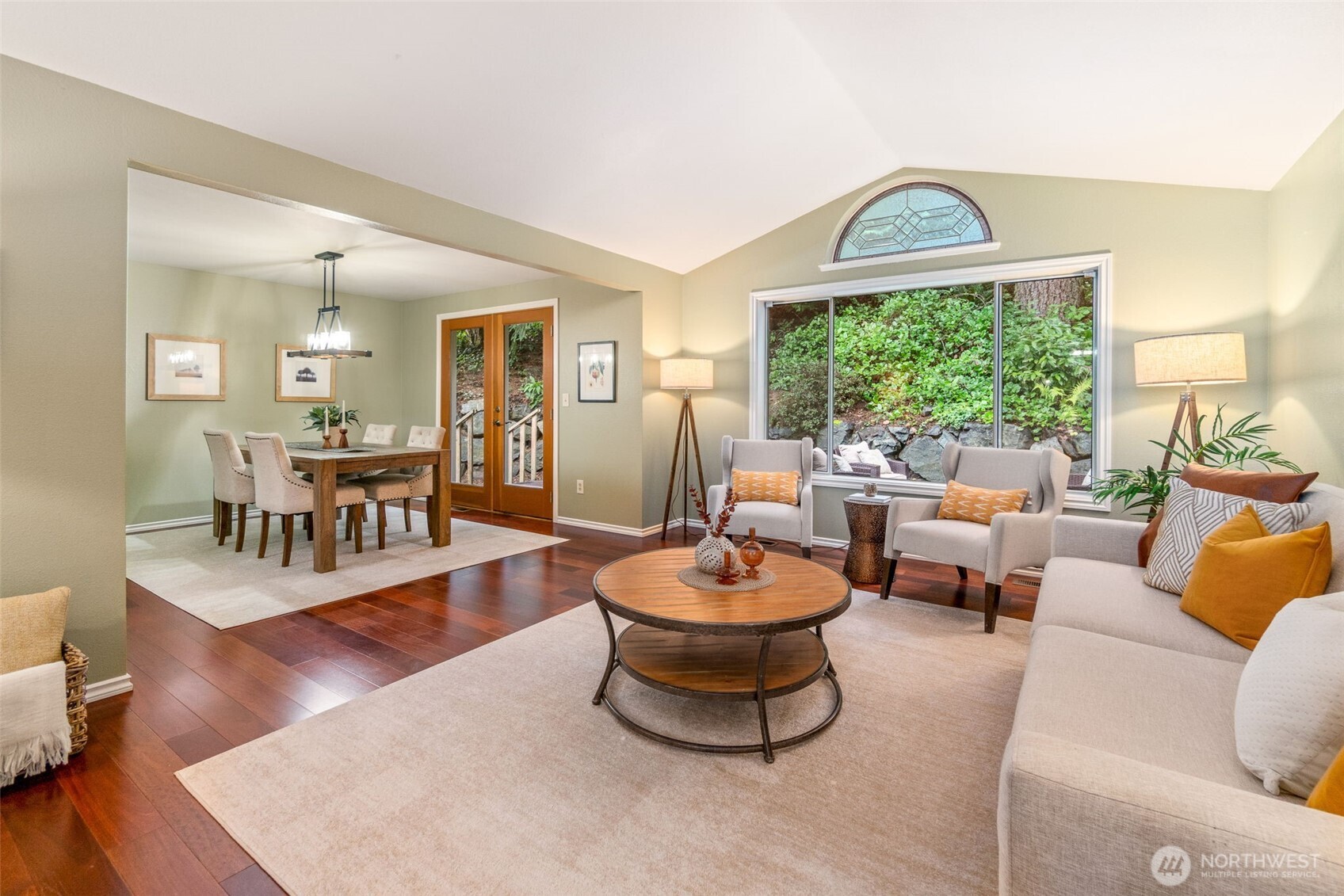 21007 Pioneer Way Edmonds, WA 98026 - Photo 5 of 27 a living room with furniture a fireplace and a large window