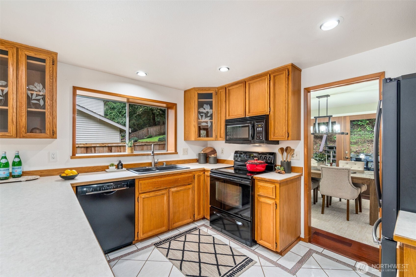 21007 Pioneer Way Edmonds, WA 98026 - Photo 8 of 27 a view of a kitchen with kitchen island granite countertop a sink appliances and cabinets