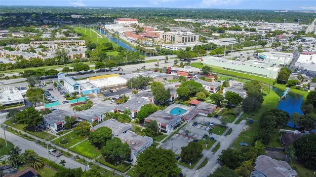 a view of a swimming pool with a garden