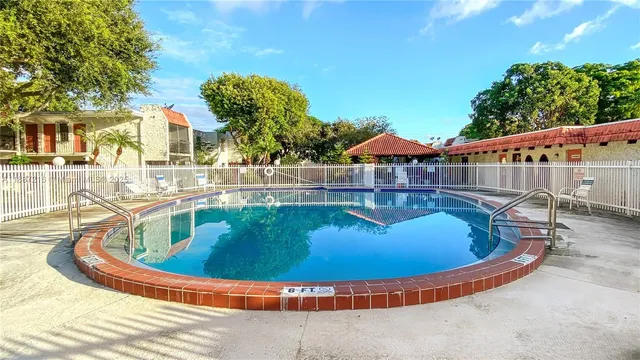 a view of a swimming pool with a lounge chairs