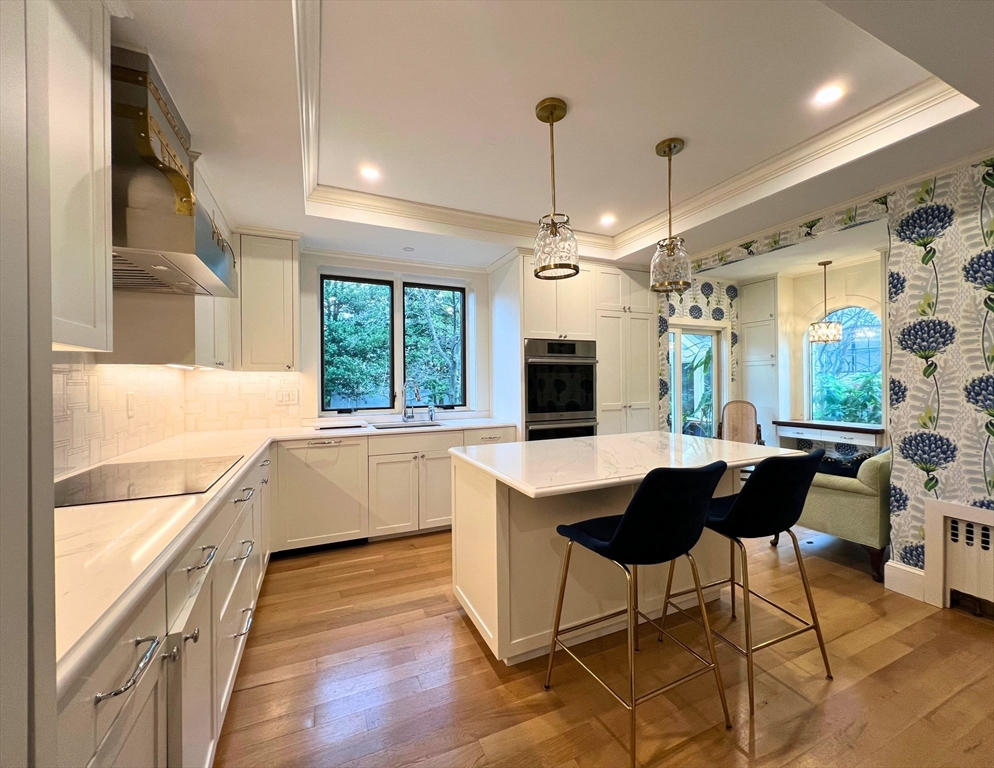 12 Brook Street Wellesley, MA 02482 - Photo 4 of 11 a kitchen with granite countertop a stove a sink and a refrigerator