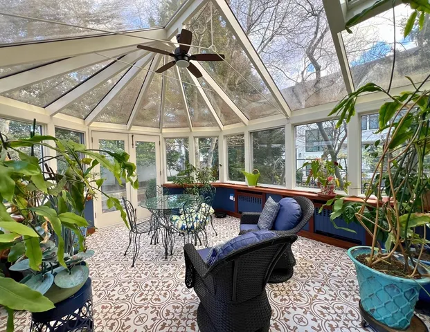 a patio with patio couch and chairs