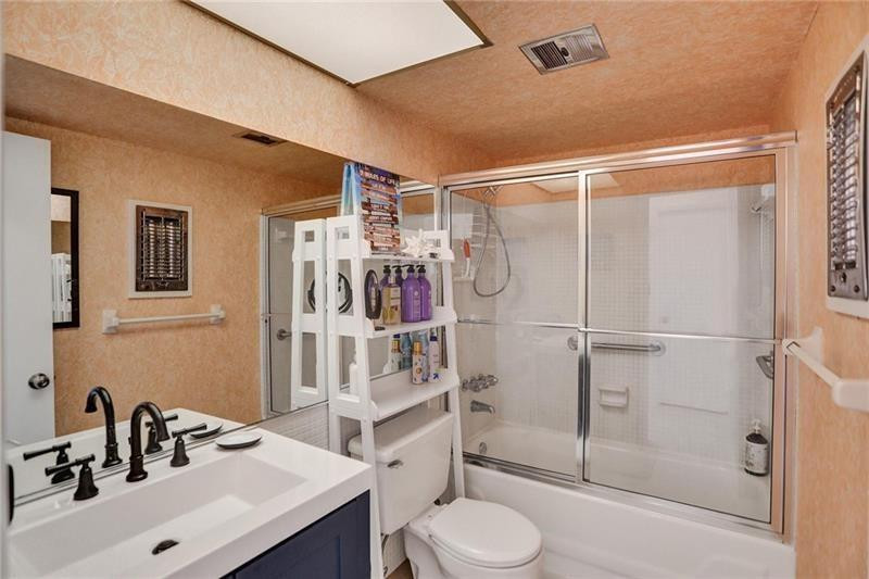 101 North Birch Road, Unit 303 Fort Lauderdale, FL 33304 - Photo 20 of 29 a bathroom with a sink toilet and shower