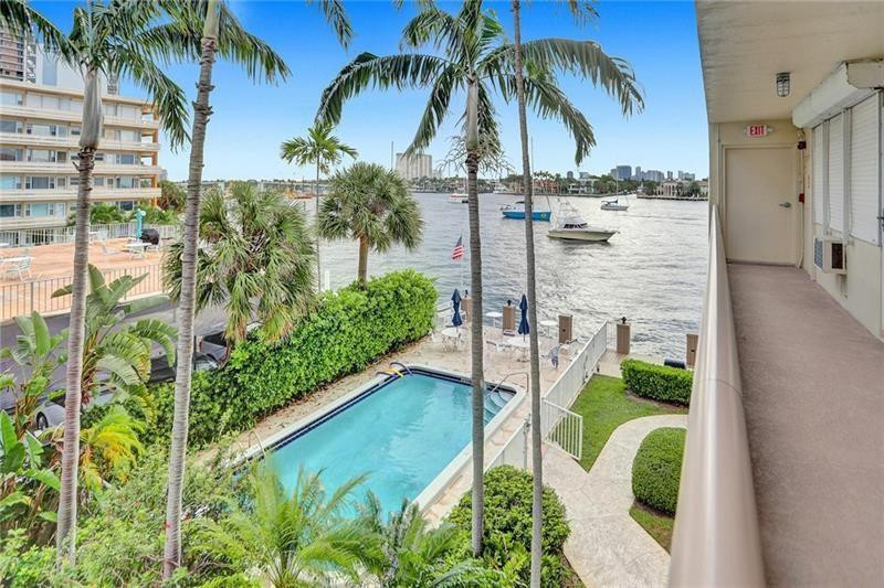 101 North Birch Road, Unit 303 Fort Lauderdale, FL 33304 - Photo 21 of 29 a view of a swimming pool with a garden
