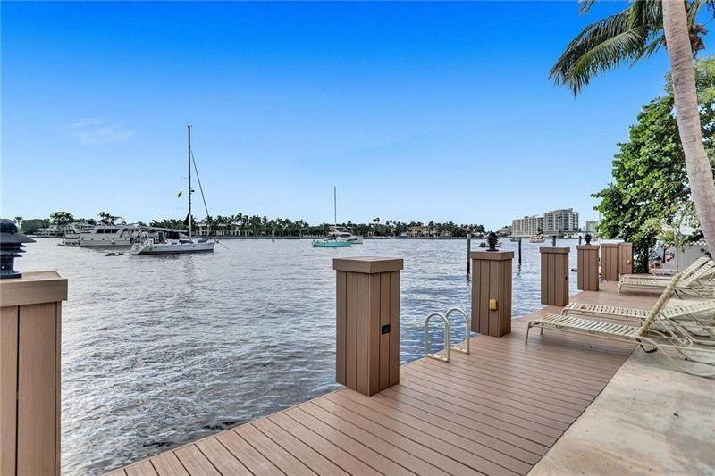 101 North Birch Road, Unit 303 Fort Lauderdale, FL 33304 - Photo 24 of 29 a view of a lake with boats and trees in the background
