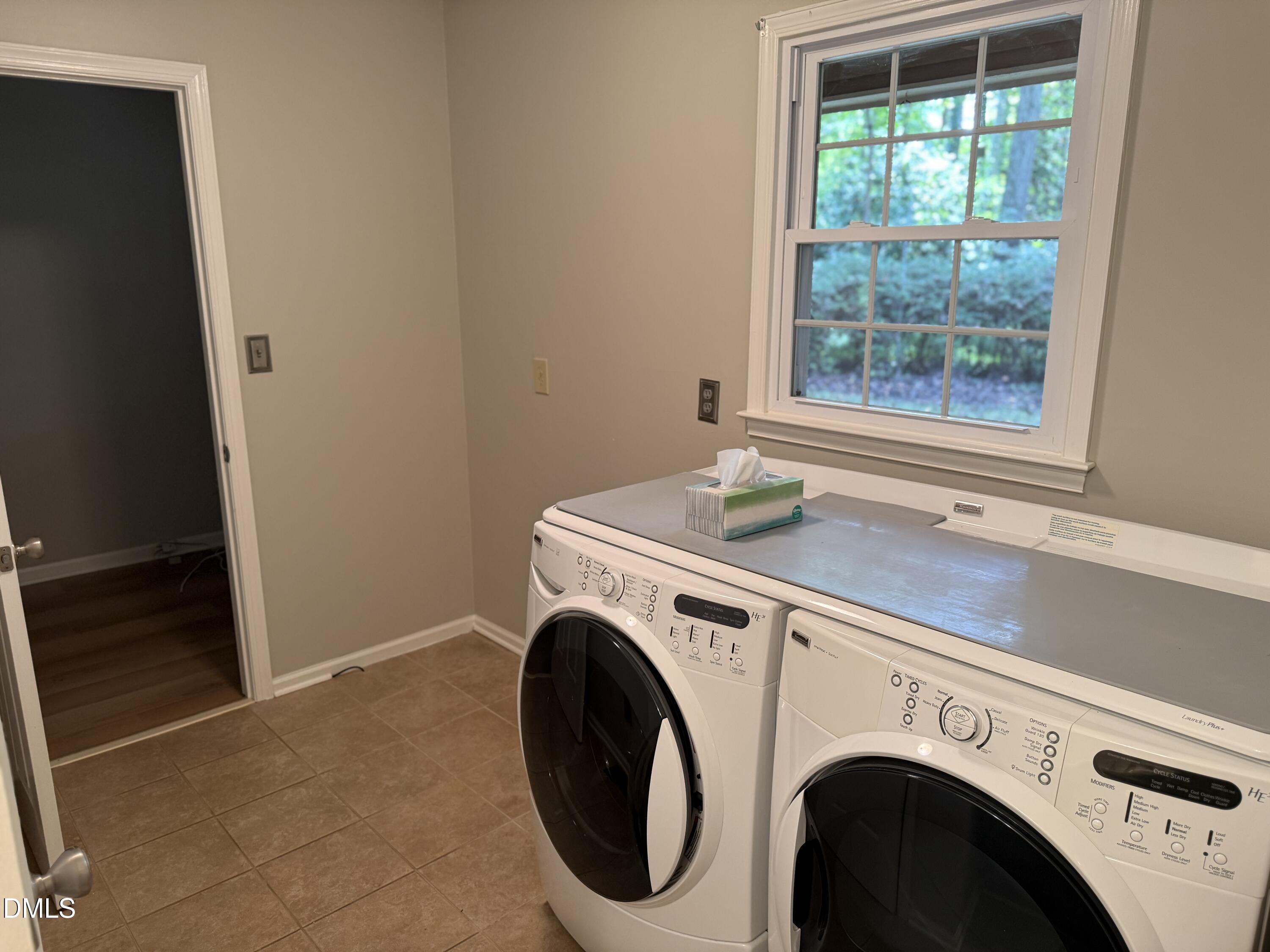 120 Keeter Circle Wake Forest, NC 27587 - Photo 16 of 36 a utility room with dryer and washer