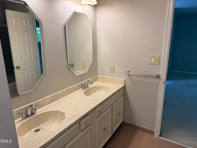 a bathroom with a glass shower door