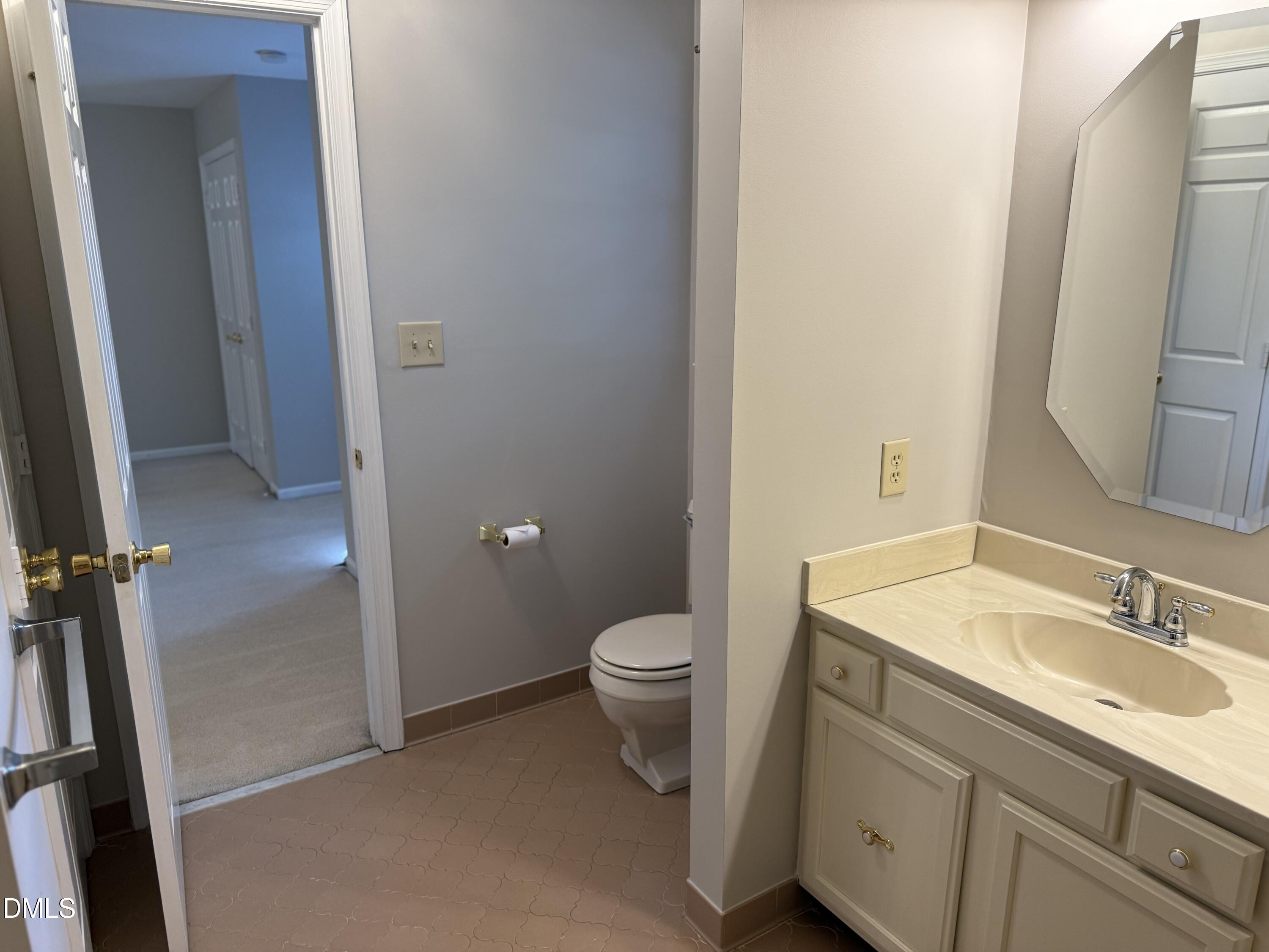 120 Keeter Circle Wake Forest, NC 27587 - Photo 21 of 36 a bathroom with a granite countertop toilet sink and mirror