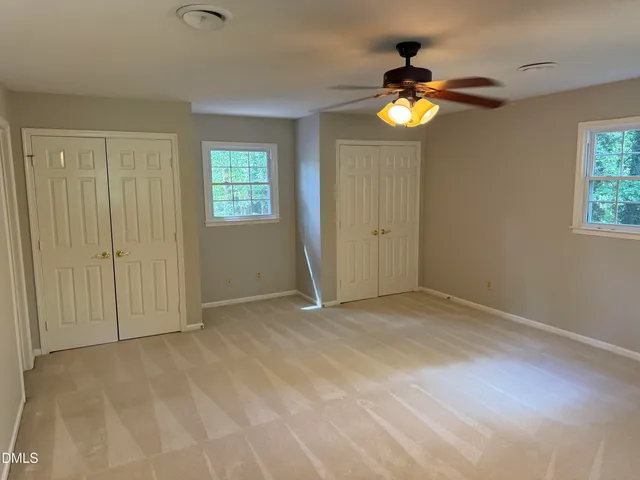 en empty room with windows