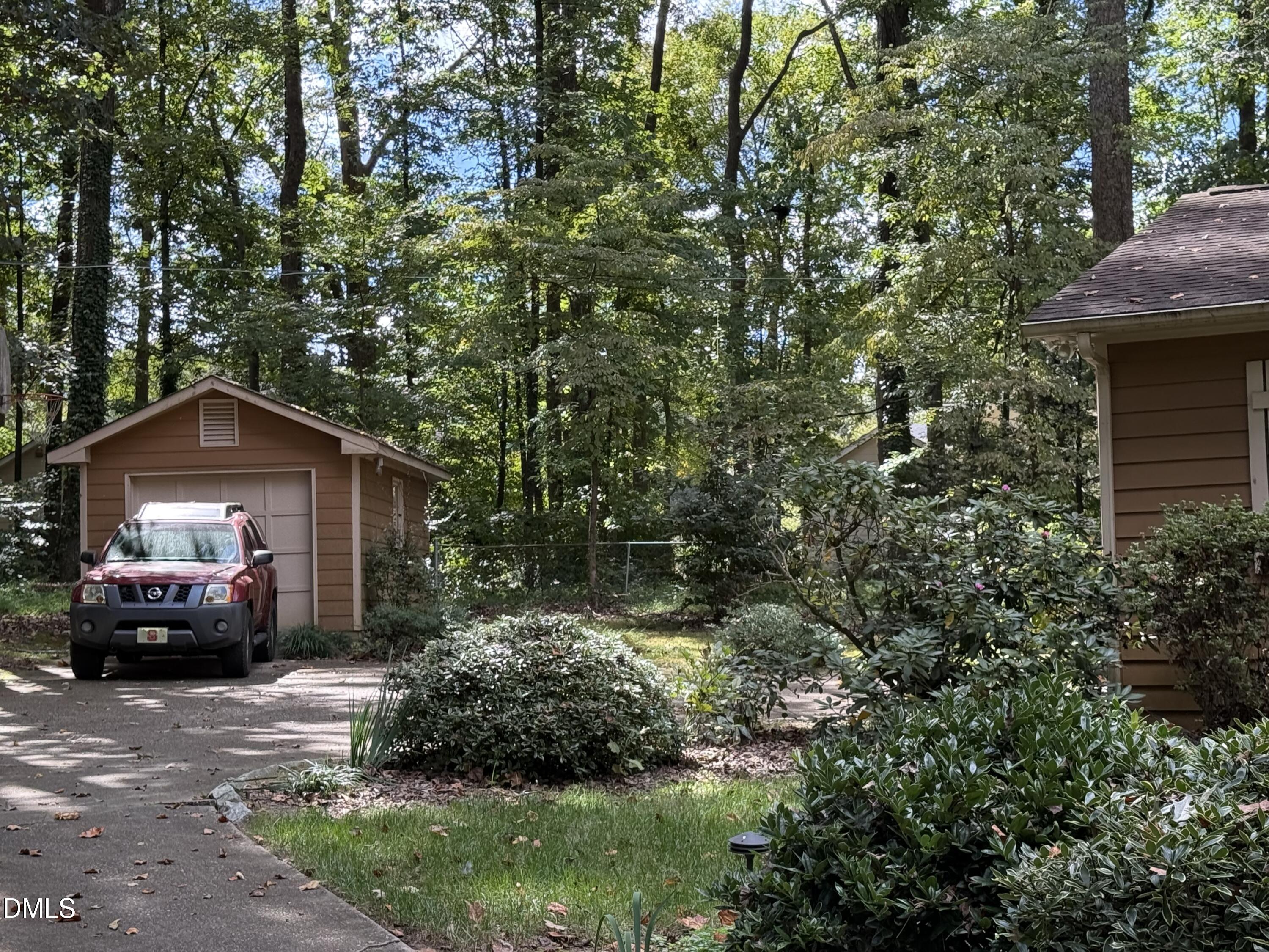 120 Keeter Circle Wake Forest, NC 27587 - Photo 26 of 36 a front view of a house with a garden