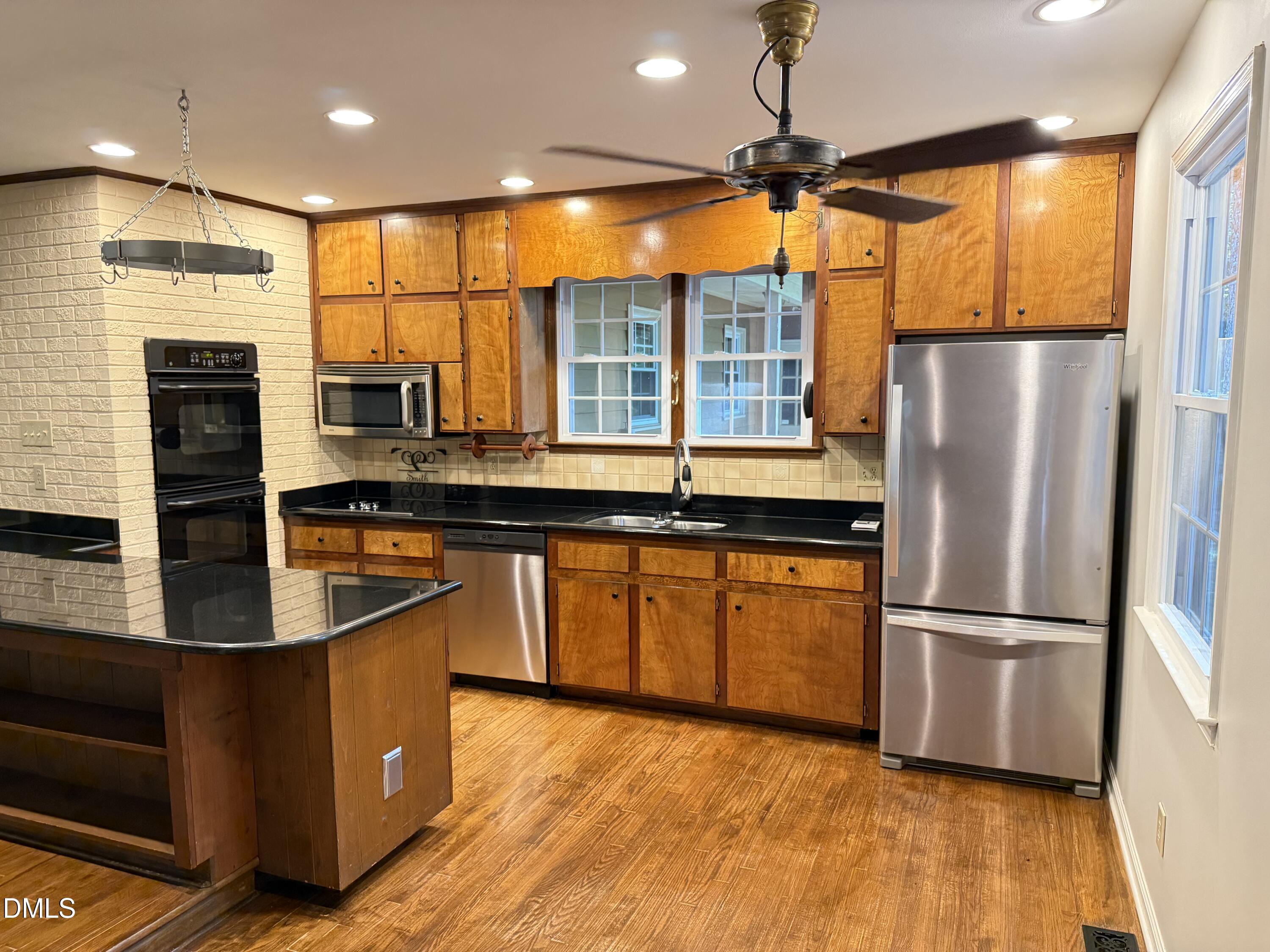 120 Keeter Circle Wake Forest, NC 27587 - Photo 3 of 36 a kitchen with stainless steel appliances granite countertop a refrigerator a sink and a stove