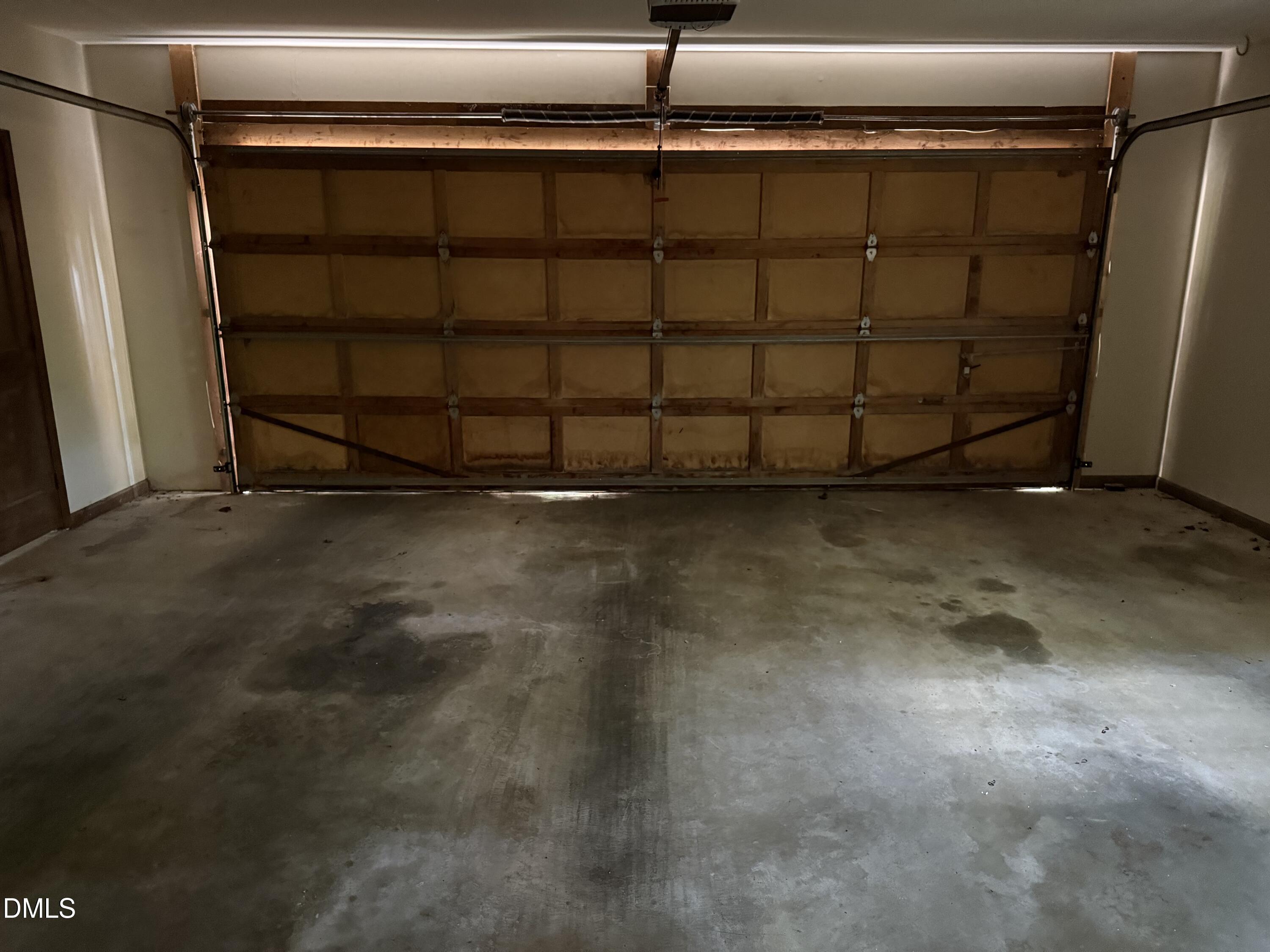 120 Keeter Circle Wake Forest, NC 27587 - Photo 34 of 36 a view of a garage with a wooden door