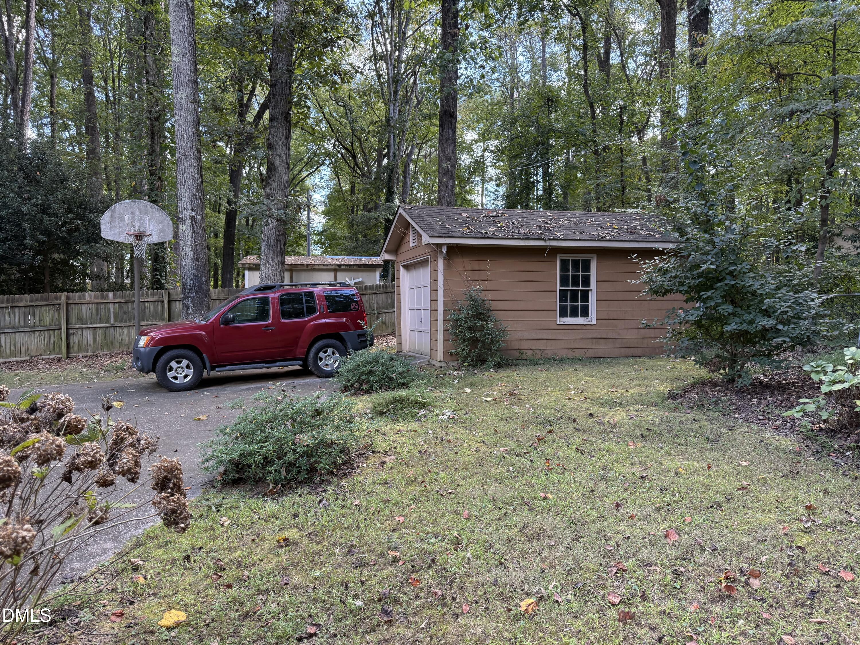 120 Keeter Circle Wake Forest, NC 27587 - Photo 35 of 36 a red car parked in front of a house
