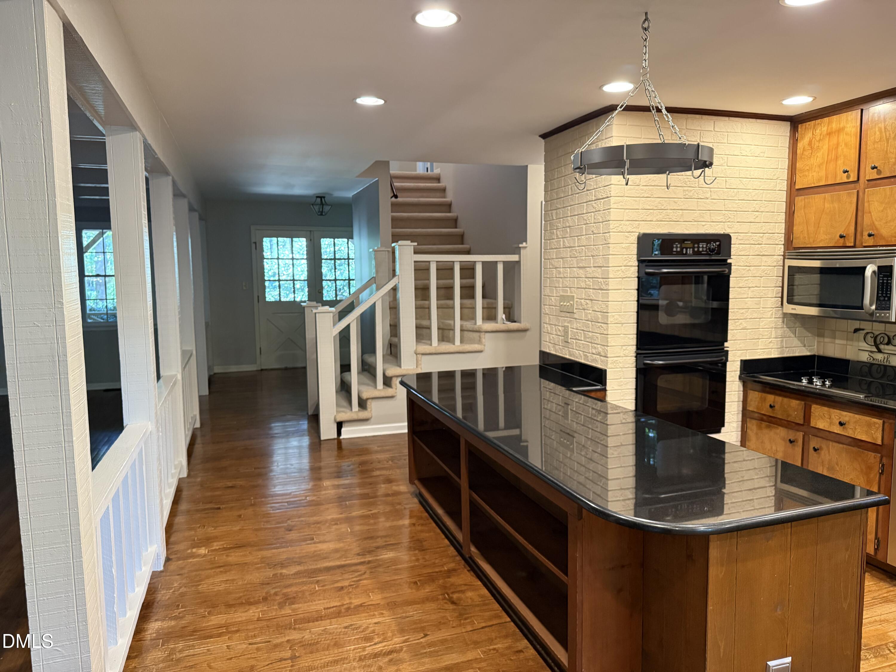 120 Keeter Circle Wake Forest, NC 27587 - Photo 4 of 36 a kitchen with kitchen island granite countertop a stove and a sink