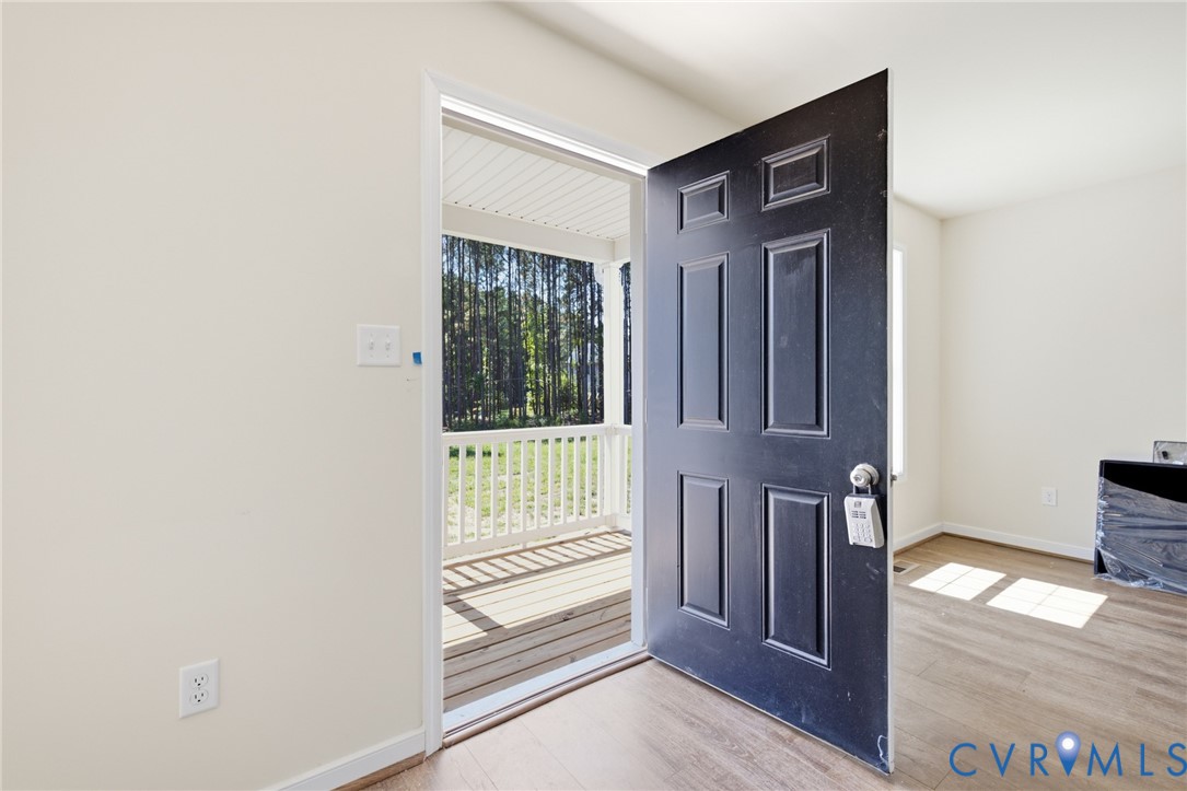 8440 Railroad Bed Road Carson, VA 23830 - Photo 26 of 39 Panel door entry with a matte black finish, leadin