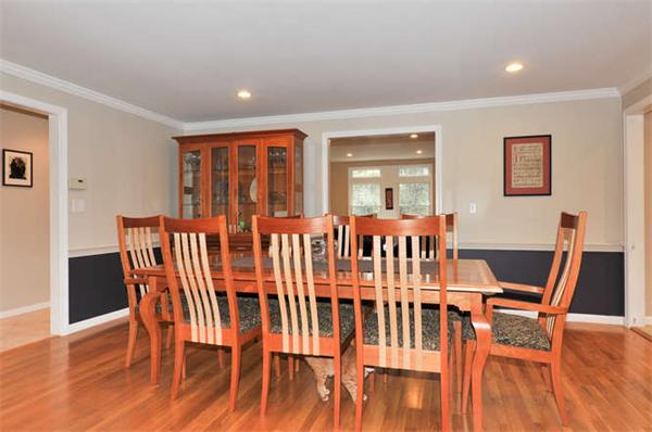 16 Virginia Ridge Road Sudbury, MA 01776 - Photo 12 of 30 a view of a dining room with furniture wooden floor and chandelier